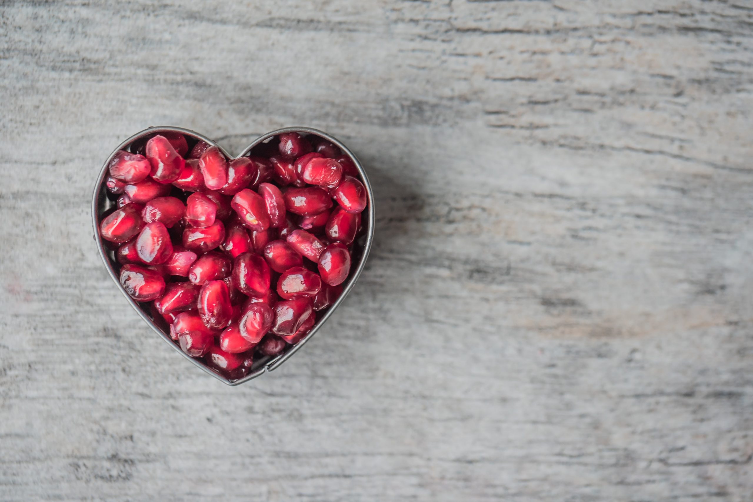 Pomegranate seeds shaped like a heart; what to know about cholesterol.